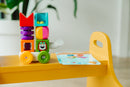 SMARTMAX My First Build & Drive is a colorful mechanical puzzle featuring various shaped blocks stacked on a wheeled base. It encourages creativity and fine motor skills in young children. The product includes instructional cards to guide building, promoting both play and learning.