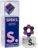 The Speks Stripes Jellyfish set features colorful magnetic spheres in red, blue, and purple, capable of creating various 3D shapes. The product is displayed in a clear packaging with a bold pink and blue label. The set serves as a fun and engaging way to relieve stress and promote creativity.