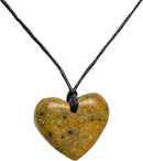 A handcrafted heart-shaped pendant made from natural stone, featuring earthy tones of brown and green, strung on a simple black cord necklace. Perfect for DIY jewelry projects or as a unique gift.