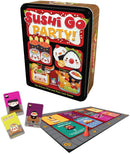 Sushi Go Party! card game by Gamewright, featuring a colorful tin box with images of various sushi pieces. The game supports 2-8 players and is designed for ages 8 and up. Includes game cards scattered on a game board that highlights different sushi-themed points and actions.