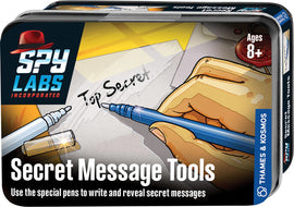 The Spy Labs: Secret Message Tools by Thames & Kosmos features a colorful tin packaging. The front shows a hand holding a blue pen, writing "Top Secret" on a paper. It highlights special pens designed to write and reveal secret messages, suitable for ages 8 and up.