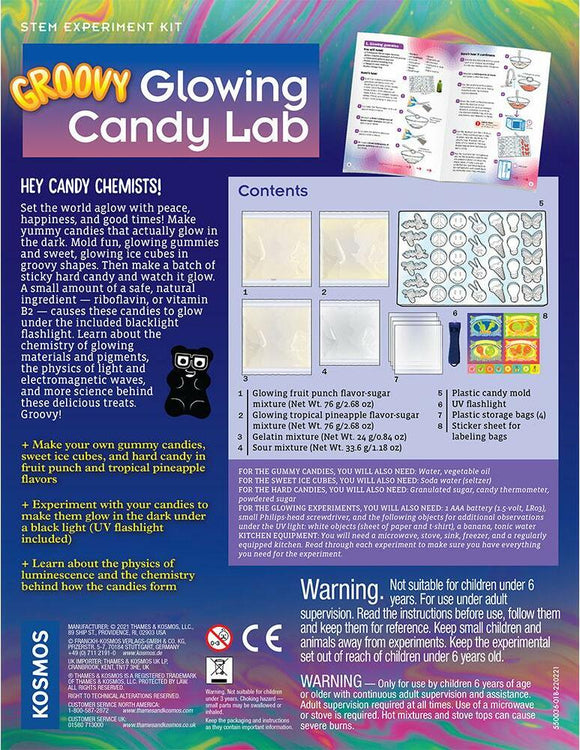 The Groovy Glowing Candy Lab STEM experiment kit packaging features a colorful design with the title prominently displayed. The contents include glowing fruit and pineapple candy mixtures, a plastic candy mold, a UV flashlight, and various tools for candy making. Instructions highlight the fun of making glowing gummy candies and exploring the science of luminescence.
