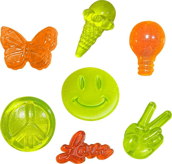 A colorful assortment of gel-like candies in various shapes including a butterfly, ice cream cone, light bulb, peace symbol, smiley face, and the word 'Love'. Each candy is vibrantly colored in shades of orange and green, displaying a fun and playful design, perfect for creative activities.