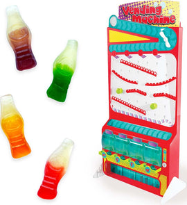 A colorful DIY Candy Vending Machine Kit by Thames & Kosmos. The machine features a bright red design with transparent containers for candy and fun gummy soda bottle candies in various colors placed in front.