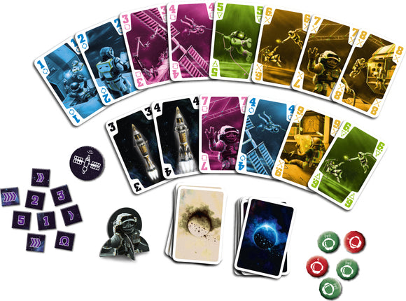 The Crew game by Thames & Kosmos featuring colorful playing cards depicting astronauts, space missions, and various game tokens. The setup includes cards in pink, blue, green, and yellow, along with character and mission tokens, showcasing a cooperative adventure theme in outer space.