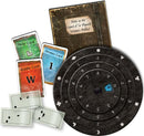 Game components for 'Exit: The Cemetery of the Knight' including a spiral game wheel, riddle cards, help cards, and a booklet titled 'Notes on the Legend of Sir Reginald Wreston's Artifact.' The cards are colorful and feature various symbols and numbers.