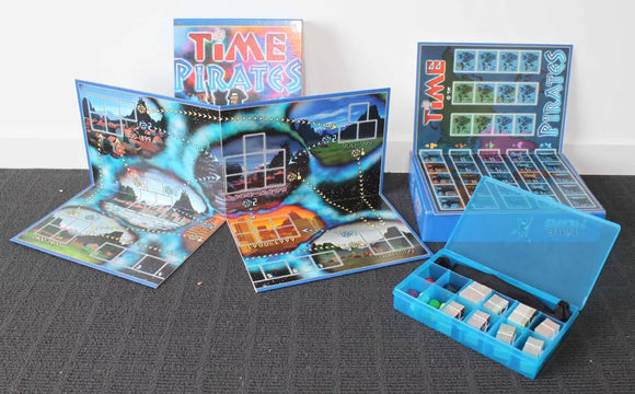 The game 'Time Pirates' by Rio Grande Games is displayed, featuring a vibrant game board with different time periods illustrated. The box is in the background, showcasing the colorful design. Various game pieces are neatly organized in a transparent case, ready for play.
