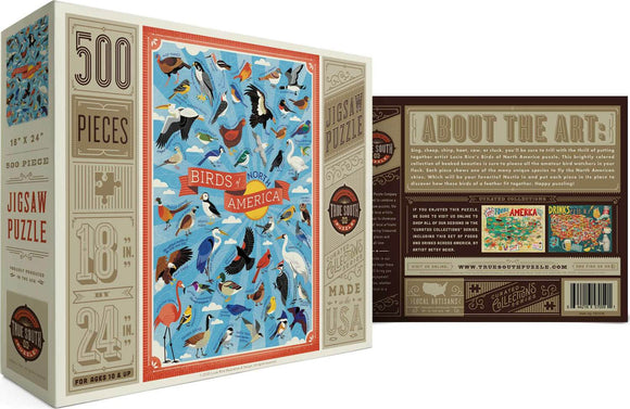 Birds of North America jigsaw puzzle by True South Puzzles. Featuring a colorful illustration of various North American bird species on a blue background. This 500-piece puzzle measures 18 x 24 inches and is suitable for ages 10 and up. The box includes details about the art and the artist, Lucie Rice.