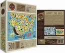 True South Puzzles Jigsaw Puzzle titled 'Birding in the USA'. The puzzle features a colorful map of the USA with various bird species highlighted in different states. The box indicates it has 500 pieces and measures 24 x 18 inches when assembled. The artwork is designed by Scott Schiller and invites bird enthusiasts to discover different bird species across the country.