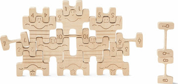 Circus Athletes game by Babai featuring wooden pieces shaped like playful athletes. The game includes numbered and smiling figures, designed for interactive fun and learning.