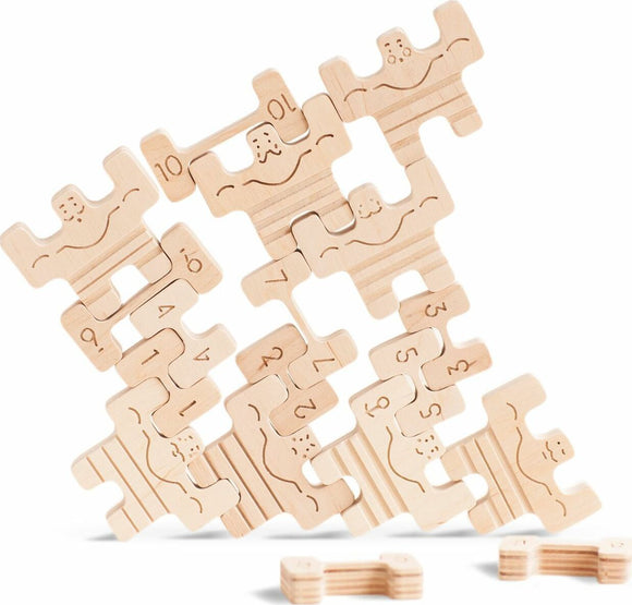 A colorful wooden game set titled 'Circus Athletes' by Babai, featuring various puzzle pieces shaped like circus performers with engravings of numbers and playful designs. The pieces are arranged in a dynamic layout, showcasing their unique shapes and intricate details suitable for children and families.