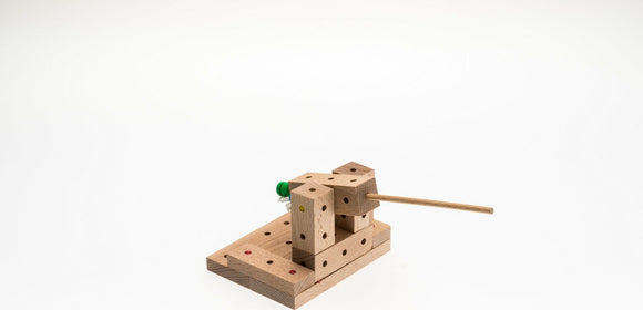 The Catapults Explorer DIY kit by Matador features 56 pieces made from natural wood, allowing users to build a functioning catapult. The design includes pegs and holes for easy assembly, promoting hands-on learning and creativity while exploring principles of physics and engineering.