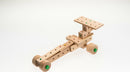 A wooden DIY kit from Matador featuring 50 pieces to create a racing car model. The kit showcases various blocks with holes and colored pegs, designed for imaginative play and construction.