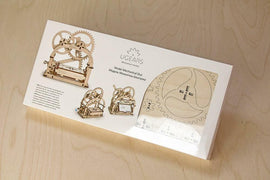 UGears 3D Mechanical Box DIY kit displayed in its packaging. The kit features intricately designed wooden gears and components, showcasing a mechanical puzzle suitable for assembly and display. The package includes images and instructions for building the model, emphasizing creativity and hands-on learning.