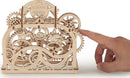 The UGears 3D Theater DIY kit featuring intricately designed wooden gears and a hand operating the mechanism. The theater showcases moving parts and a vintage aesthetic, perfect for model-making enthusiasts.