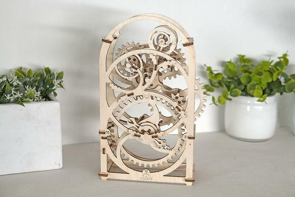 UGears 3D 20-Minute Timer DIY kit featuring intricate gears and wooden construction. Perfect for hands-on learning and creativity, this mechanical timer adds a charming decor element.