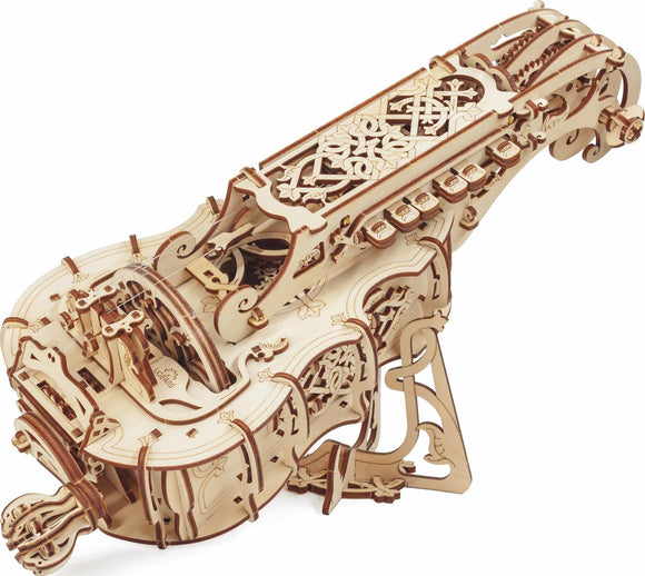 Detailed view of the UGears 3D Hurdy-Gurdy DIY kit, showcasing intricate wooden parts and ornate designs. The mechanical instrument features a unique, vintage appearance with decorative elements and a sturdy base. Perfect for enhancing creativity and engineering skills.