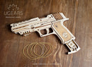 The UGears 3D Wolf-01 Handgun is a detailed wooden mechanical model kit. It features intricate engravings and a realistic design, with rubber bands included for functioning mechanisms. The model is displayed on a wooden surface, highlighting its craftsmanship.