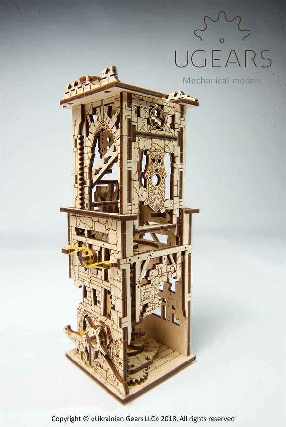 UGears 3D Archballista-Tower DIY kit made of precision-cut wood. The intricate design features a tower structure with gears and decorative elements, ideal for crafting enthusiasts.