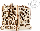 UGears 3D Dice Keeper made from precision-cut wood, featuring intricate designs and mechanics. It's a DIY kit for organizing dice, showcasing artistic craftsmanship and functionality.
