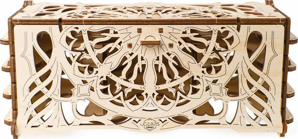 The UGears 3D Card Holder is an intricate DIY kit made from light-colored wood, featuring beautifully laser-cut patterns. It consists of a box with multiple compartments and a decorative design that combines elegance and functionality, ideal for organizing cards and small items.