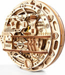 A detailed view of the UGears 3D Monowheel DIY kit, showcasing its intricate wooden design with gears, levers, and mechanical components. The model features labeled parts such as 'STOP' and 'FULL AHEAD', emphasizing its interactive nature as a mechanical puzzle. This unique kit is made from high-quality wood, providing an engaging building experience for enthusiasts and puzzle lovers.