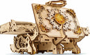 The UGears 3D Amber Box is a beautifully crafted DIY mechanical model made from high-quality wood. It features intricate designs, amber resin inlays, and an elegant floral motif. The model can be assembled to create a functional storage box with a unique, vintage aesthetic.
