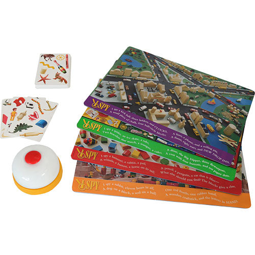 I Spy Eagle Eye game by Briarpatch Inc. includes colorful cards featuring various objects in detailed scenes, a bell, and challenge cards for engaging gameplay. Ideal for family fun and developing observational skills.