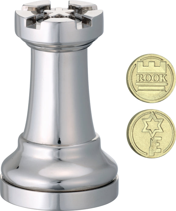 A polished silver chess piece shaped like a rook, prominently displayed. Beside it are two gold coins, one labeled 'ROOK' and the other featuring a star symbol. The rook boasts detailed craftsmanship, with a classic design and a shiny finish, emphasizing its mechanical puzzle feature.