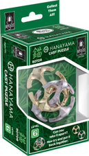 The Hanayama Cast Rotor puzzle features an intricately designed mechanical puzzle in metallic silver and gold colors. The puzzle presents a challenging level 6 difficulty, encouraging users to disassemble and reassemble it. The packaging includes a vibrant green background with leaf motifs and the brand logo, emphasizing its collectible nature.