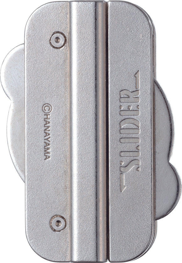 The Cast Slider by Hanayama is a uniquely designed mechanical puzzle featuring a sleek, silver finish. Its compact build includes two main sliding components that challenge users to figure out how to separate them, offering an engaging brain teaser experience. Ideal for puzzle enthusiasts, it combines aesthetic minimalism with complex problem-solving mechanics.