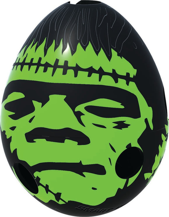 The Smart Egg - Frankenstein is a mechanical puzzle shaped like an egg, featuring a striking design with a green Frankenstein face against a black background. The puzzle includes holes for interactive play, challenging users to navigate the inner maze to unlock its secrets.