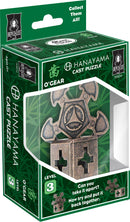 The Cast O'Gear mechanical puzzle by Hanayama features an intricate, metallic design. Packaged in a bright green box with an artistic background and clear display window, the product showcases a level 3 difficulty rating. The design includes a unique geometric shape with notches and curves, challenging the user to disassemble and reassemble it. The text on the box highlights its complexity and encourages players to test their problem-solving skills.