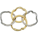 A close-up view of the Cast Ring mechanical puzzle by Hanayama, featuring four interlocking rings in various metallic colors including gold and silver. The intricate design challenges the user to separate and reassemble the rings. Ideal for puzzle enthusiasts seeking a unique brain-teaser.