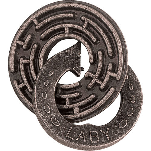 The Cast Labyrinth puzzle by Hanayama features a circular, labyrinthine design made of metal. It includes two interlocking pieces, one shaped like a winding path and emblazoned with the letters 'LABY'. The intricate maze pattern invites users to solve the challenge of separating the pieces, making it an engaging mechanical puzzle for enthusiasts and casual players alike.