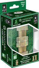 The Hanayama Cast Nutcase, a mechanical puzzle, showcases an intricate design resembling a metal nut and bolt. The puzzle is presented in a colorful box featuring a spider logo, indicating its Bepuzzled brand. It is designed for ages 12 and up, with a difficulty level of 6. Instructions are included on the box, challenging users to take it apart and then reassemble it.