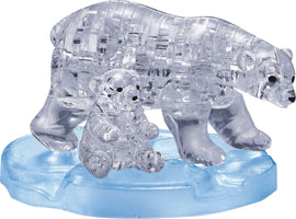 A beautifully crafted 3D crystal jigsaw puzzle featuring a polar bear and its cub, both made of clear crystal. They are perched on a blue ice-like base, showcasing intricate detailing and craftsmanship that brings the figures to life.