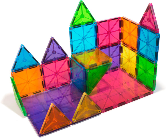 A colorful set of Magna Tiles in clear hues, featuring various geometric shapes including triangles and squares. The pieces are arranged to form a vibrant castle-like structure, showcasing the creativity and potential for imaginative building. Each tile is transparent, allowing light to pass through, enhancing the playful colors including red, blue, green, yellow, and purple.