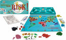 An image of the board game 'Risk!' by Winning Moves. The game includes a colorful map of the world with territories colored in various shades. Several red, green, blue, and black game pieces are scattered around the board, alongside dice and cards. The box of the game is shown, featuring the title 'Risk!' prominently. The layout suggests an engaging strategy game perfect for multiplayer fun.