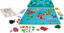 The game Risk by Winning Moves, featuring a colorful world map game board. Small plastic pieces in various colors represent armies, with dice and mission cards scattered around. The box includes strategic components for global domination gameplay.
