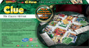 Clue Classic Edition game board featuring vibrant game pieces, suspect cards, and a detailed board layout depicting various rooms in the mansion. The game comes with a rotating magnifying glass graphic and highlights favorite characters, rooms, and weapons, inviting players to solve a classic murder mystery.