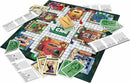 The Clue board game by Winning Moves, featuring a colorful game board with different rooms, player tokens in various colors, and a pile of cards and detective notes scattered around. The board has images of rooms such as the ballroom and kitchen, along with the iconic Clue logo prominently displayed in the center.