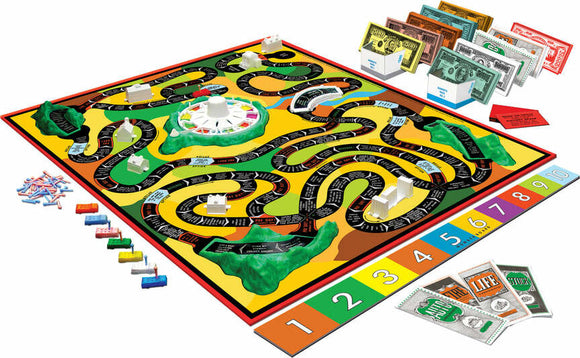 The Game of Life board game by Winning Moves. Features a colorful game board with winding paths, houses, money, and player pieces. The game includes bills of various denominations.