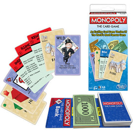 Monopoly: The Card Game by Winning Moves featuring various game cards, including property cards, money, and tokens. The packaging shows a colorful design with the iconic Monopoly logo and a description emphasizing its status as an exciting card version of the classic game. Items are displayed alongside the game box, showcasing the engaging gameplay elements such as the Wild card and the banknotes.