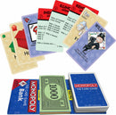 A colorful arrangement of Monopoly: The Card Game components, featuring various cards including property cards such as Illinois Avenue and Kentucky Avenue, a Wild card, and denominations of Monopoly money. The game is presented in a compact format with a draw pile and bank section, highlighting the strategic gameplay of card-based Monopoly.